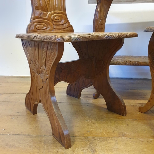 36 - A pair of Japanese carved wood high back chairs, a similar two tier table, 88 cm wide, a round table... 