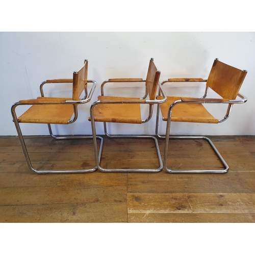 43 - A set of three leather and chrome armchairs (3)