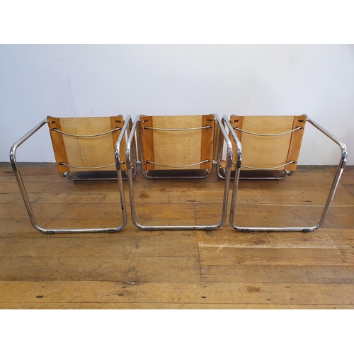 43 - A set of three leather and chrome armchairs (3)