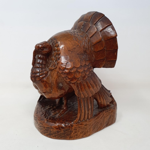 51 - A carved figure of a turkey, by Anna Edith (Nancy) Catford (1905-1992), signed in ink NANCY CATFORD ... 