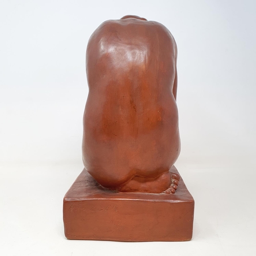 60 - An Art Deco style terracotta figure, of a kneeling woman, 32 cm high