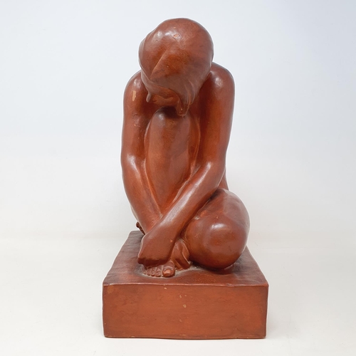 60 - An Art Deco style terracotta figure, of a kneeling woman, 32 cm high