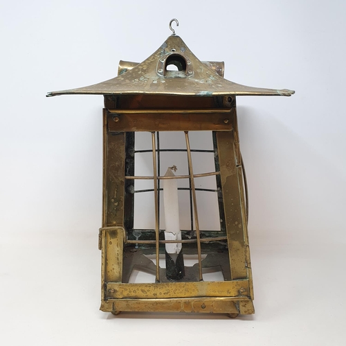 69 - An Arts and Crafts style brass lantern, 33 cm high