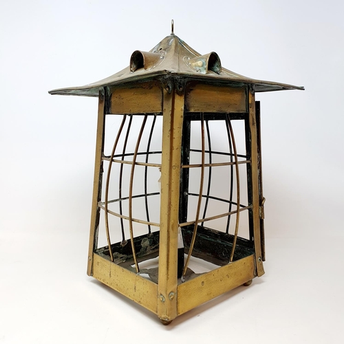 69 - An Arts and Crafts style brass lantern, 33 cm high