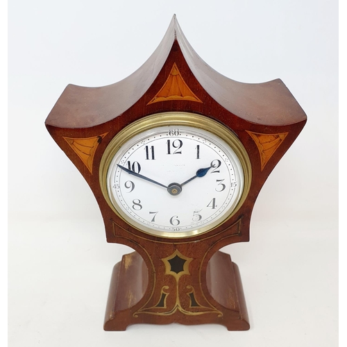 85 - An Art Nouveau style mantel clock, with an enamel dial, with Arabic numerals, with an eight day move... 