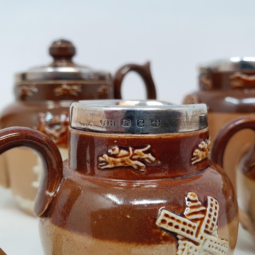 89 - A Doulton Lambeth four piece tea service, with silver mounts (4)