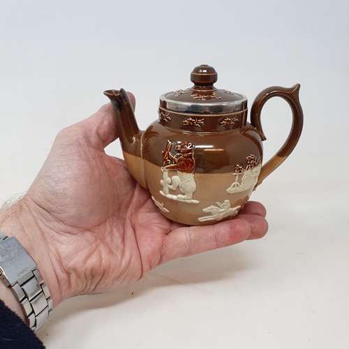 89 - A Doulton Lambeth four piece tea service, with silver mounts (4)