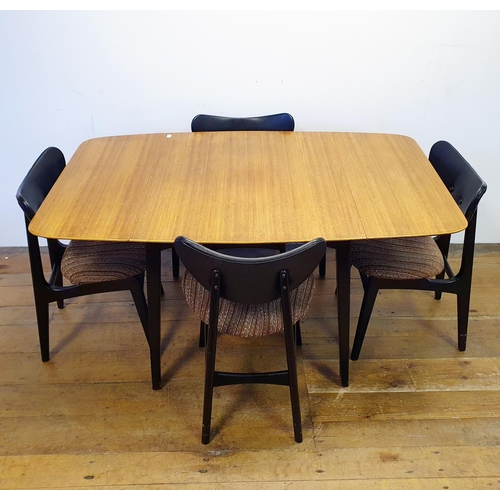 9 - A 1960s G-Plan dining room suite, comprising a sideboard, 133 cm wide, a dining table and four chair... 