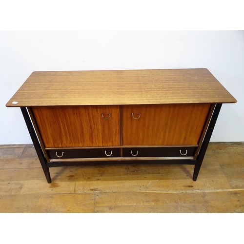 9 - A 1960s G-Plan dining room suite, comprising a sideboard, 133 cm wide, a dining table and four chair... 