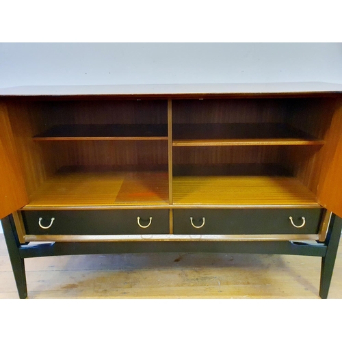 9 - A 1960s G-Plan dining room suite, comprising a sideboard, 133 cm wide, a dining table and four chair... 