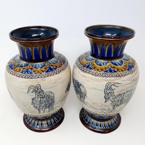 97 - A pair of Doulton Lambeth vases, by Hannah Barlow, decorated goats, 26 cm high