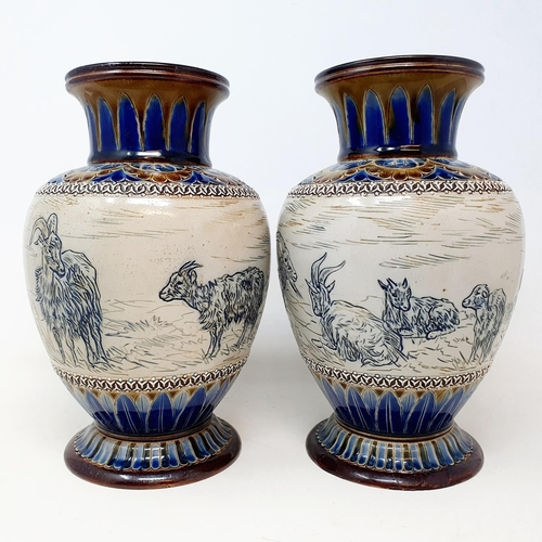 97 - A pair of Doulton Lambeth vases, by Hannah Barlow, decorated goats, 26 cm high