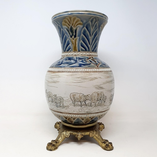 98 - A Royal Doulton vase, by Hannah Barlow, decorated sheep, on a gilt metal base, 34 cm high