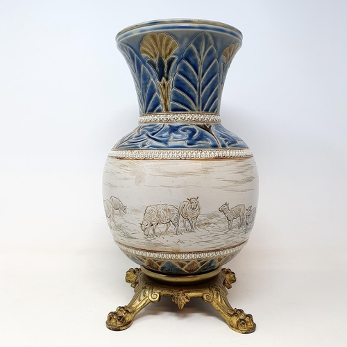 98 - A Royal Doulton vase, by Hannah Barlow, decorated sheep, on a gilt metal base, 34 cm high