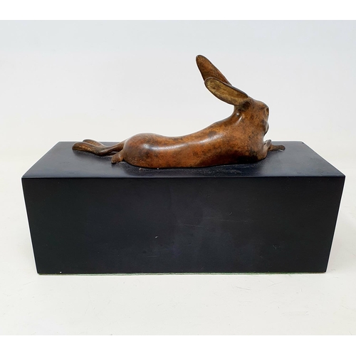 99 - A bronze figure of a rabbit, on a slate base, 22 cm wide