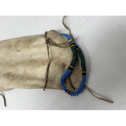 773 - A Native American Indian beaded pipe bag, 104 cm (over tassels)