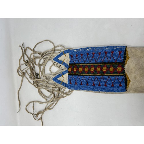 773 - A Native American Indian beaded pipe bag, 104 cm (over tassels)