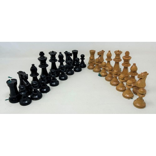 774 - A red stained and natural bone chess set, the king 11 cm high, and a black and natural wood chess se... 