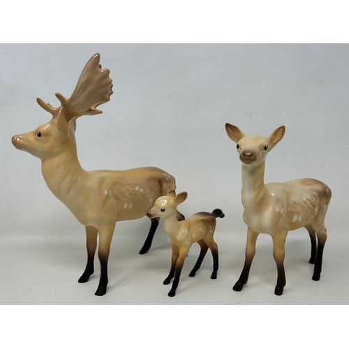 793 - A Beswick stag, a deer, a fawn, and two Babycham fawns (5)