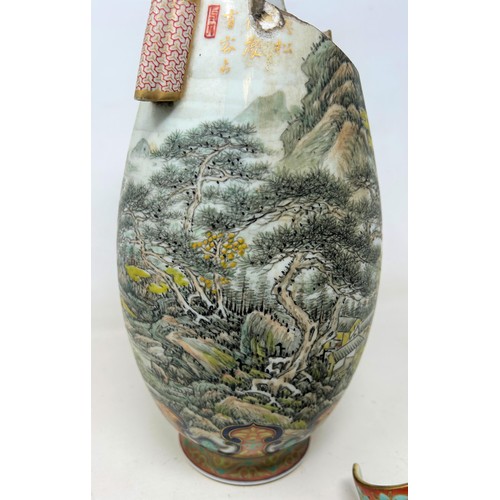 737 - A Japanese vase, decorated a mountainous landscape and script, 32 cm high