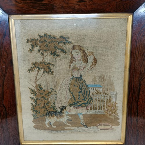 600 - A 19th century needlework panel, of a young girl with two cats, 32 x 26 cm, in a rosewood frame