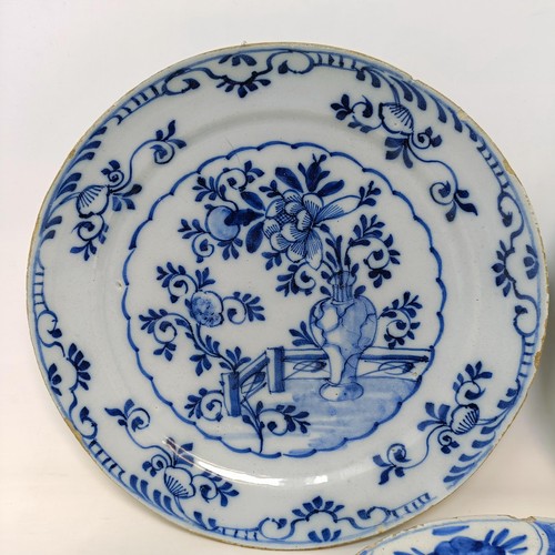 604 - A 19th century Delft blue and white plate, 22 cm diameter, and two others (3)