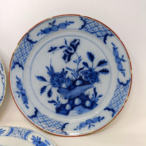 604 - A 19th century Delft blue and white plate, 22 cm diameter, and two others (3)