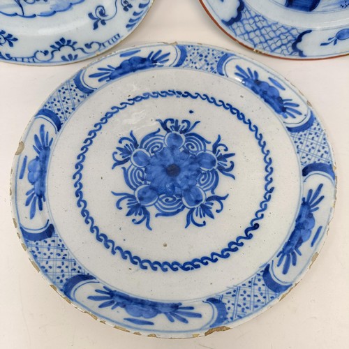 604 - A 19th century Delft blue and white plate, 22 cm diameter, and two others (3)