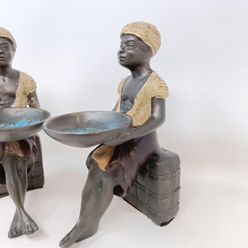 606 - A pair of cold painted bronze salts, in the form of eastern boys, 20 cm high (2)