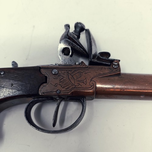 608 - A flintlock pistol muff type pistol, 16 cm