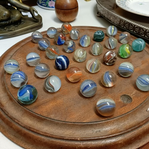 613 - A solitaire board, with marbles, 40 cm diameter