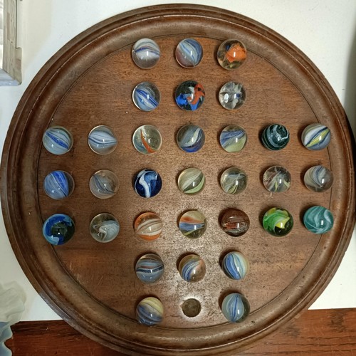 613 - A solitaire board, with marbles, 40 cm diameter