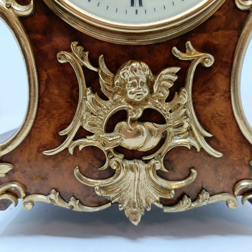 627 - A French mantel clock, the 9 cm diameter enamel dial with Roman numerals, fitted an eight day moveme... 