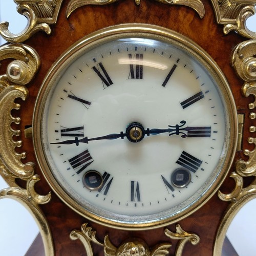 627 - A French mantel clock, the 9 cm diameter enamel dial with Roman numerals, fitted an eight day moveme... 