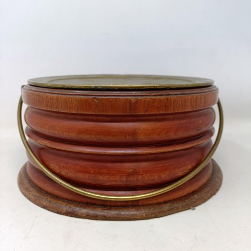 657 - A 19th century mahogany and brass foot warmer, with a ring handle, 28 cm diameter