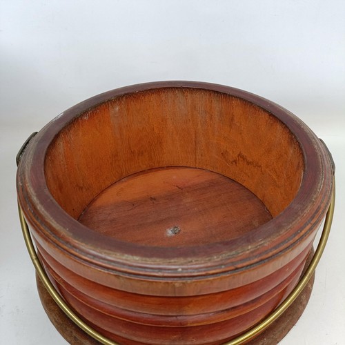 657 - A 19th century mahogany and brass foot warmer, with a ring handle, 28 cm diameter