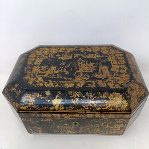 662 - A 19th century lacquered caddy, in the Chinese manner, 30 cm wide