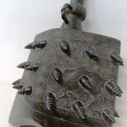 669 - A Chinese bronze altar bell, 20 cm high