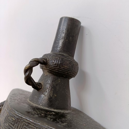 669 - A Chinese bronze altar bell, 20 cm high