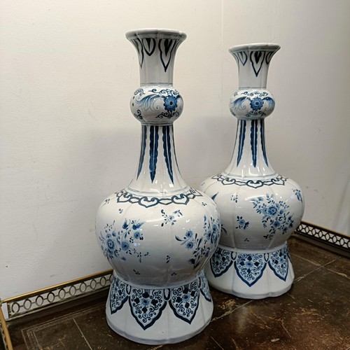 732 - A large pair of Delft blue and white vases, 65 cm high