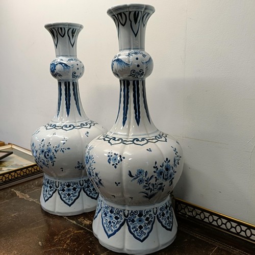 732 - A large pair of Delft blue and white vases, 65 cm high