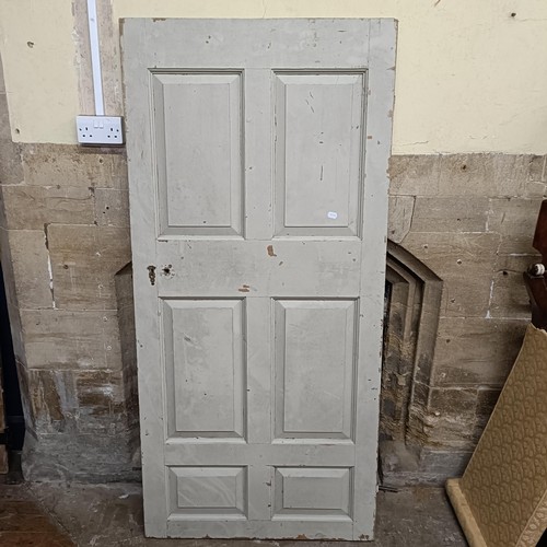 974 - An oak door, 176 x 82 cm, and two other doors (3)