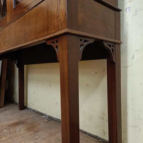 975 - A mahogany display cabinet, raised on square feet, 124 cm wide