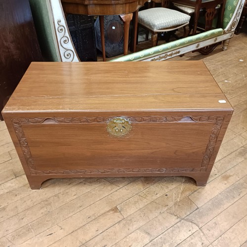 969 - A mahogany bow front chest, having two short and two long drawers, 85 cm wide, and a camphorwood che... 