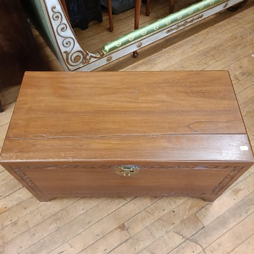 969 - A mahogany bow front chest, having two short and two long drawers, 85 cm wide, and a camphorwood che... 