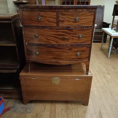 969 - A mahogany bow front chest, having two short and two long drawers, 85 cm wide, and a camphorwood che... 