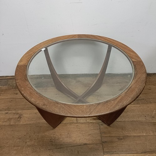 128 - A G-Plan teak and glass topped coffee table, 85 cm diameter