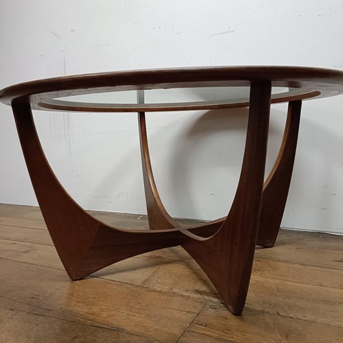 128 - A G-Plan teak and glass topped coffee table, 85 cm diameter