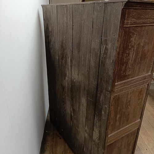 29 - An oak wardrobe with carved doors, 122 cm wide (2)