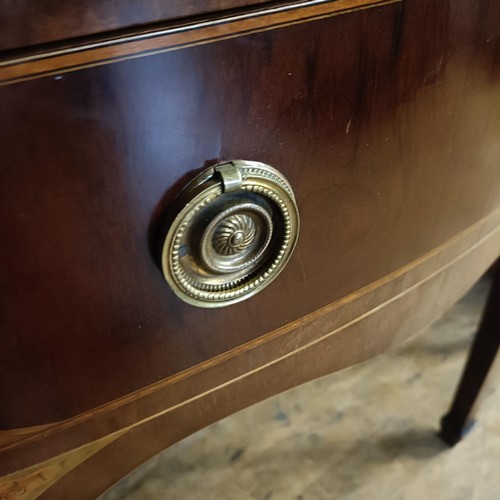 933 - A George III style serpentine sideboard, with a drawer, flanked by four short drawers, 122 cm wide